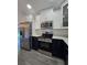 Modern kitchen with stainless steel appliances, dark blue cabinets and a view to the outside at 263 Oak Lane Trak, Ocala, FL 34472