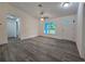 Spacious living room with a new front door, modern floors and bright window at 263 Oak Lane Trak, Ocala, FL 34472