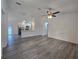 Open-concept living room with modern gray flooring and view into the kitchen area at 263 Oak Lane Trak, Ocala, FL 34472