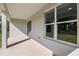 Covered porch featuring ample sunlight and provides an inviting extension of the home at 2647 Sw 178 St, Ocala, FL 34473