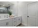 Bright bathroom features double sinks, sleek white cabinets, and modern fixtures at 2647 Sw 178 St, Ocala, FL 34473