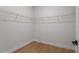 A walk-in closet with wood flooring and wire shelving maximizes storage space at 2647 Sw 178 St, Ocala, FL 34473