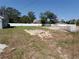 Large, mostly-cleared back yard with white privacy fence; ready for customization at 28 Olive Dr, Ocala, FL 34472