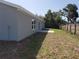 The backyard features a patio area, providing a perfect space for outdoor dining at 28 Olive Dr, Ocala, FL 34472