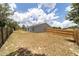 The backyard features a wooden fence and a concrete patio, providing a great space for outdoor activities at 28 Olive Dr, Ocala, FL 34472