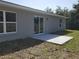 Backyard with a concrete patio, providing a versatile outdoor living space at 28 Olive Dr, Ocala, FL 34472
