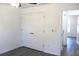 Bedroom with a double door closet and view to hallway at 28 Olive Dr, Ocala, FL 34472