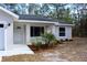 Charming single-story home with a freshly landscaped front entrance at 28 Olive Dr, Ocala, FL 34472