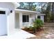 Charming single-story home with a freshly landscaped front entrance at 28 Olive Dr, Ocala, FL 34472
