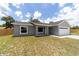 Well-maintained single-story home featuring a two-car garage and a modern design at 28 Olive Dr, Ocala, FL 34472