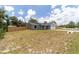 Spacious single-story home featuring a two-car garage and a large front yard at 28 Olive Dr, Ocala, FL 34472