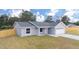Charming single-story home featuring a two-car garage, a well-maintained lawn and a modern design at 28 Olive Dr, Ocala, FL 34472