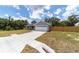 Inviting home with a spacious driveway and lush surroundings at 28 Olive Dr, Ocala, FL 34472