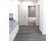 Hallway with view of bathroom and kitchen with granite countertop at 28 Olive Dr, Ocala, FL 34472