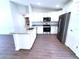 Modern kitchen featuring stainless steel appliances, granite countertops, and white cabinets at 28 Olive Dr, Ocala, FL 34472