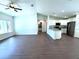 Open-concept living area featuring modern flooring, a ceiling fan and bright, natural light at 28 Olive Dr, Ocala, FL 34472