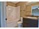 Cozy bathroom with a combined shower and tub, updated vanity, and modern fixtures at 3064 Sw Deerpark Heights Rd, Dunnellon, FL 34431