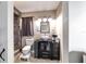 Modern bathroom with a vessel sink, decorative mirror, and tiled shower with river rock floor at 31 Palm Rd, Ocala, FL 34472