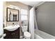 Bathroom features a modern vanity, toilet, and tiled shower with curtain at 31 Palm Rd, Ocala, FL 34472