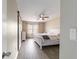Bright bedroom features a ceiling fan, light-colored walls and wood-look floors, complemented by a window at 31 Palm Rd, Ocala, FL 34472