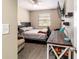 Bedroom has wood-look flooring, modern ceiling fan and a large window at 31 Palm Rd, Ocala, FL 34472