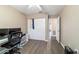 Bedroom features wood-look flooring, closet, and a modern ceiling fan at 31 Palm Rd, Ocala, FL 34472
