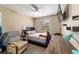 Bedroom offers wood-look flooring, a large window, and modern fan at 31 Palm Rd, Ocala, FL 34472