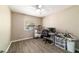 Office features a ceiling fan, wood-look floors, and natural light from the window at 31 Palm Rd, Ocala, FL 34472