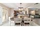 Open dining area with a wooden table and access to the kitchen and living room at 31 Palm Rd, Ocala, FL 34472