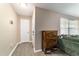 Welcoming foyer features wood-look flooring and a charming storage cabinet at 31 Palm Rd, Ocala, FL 34472