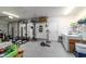 Garage space with storage, a washer, dryer, and fitness equipment at 31 Palm Rd, Ocala, FL 34472