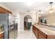 Open kitchen featuring stainless steel appliances, ample counter space, and easy access to the living area at 31 Palm Rd, Ocala, FL 34472