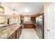 Kitchen with stainless steel appliances, dark wood cabinetry, and an island for added counter space at 31 Palm Rd, Ocala, FL 34472