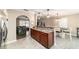 Open kitchen with granite countertops and seating to dining area and living room at 31 Palm Rd, Ocala, FL 34472