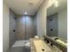 Bathroom featuring a modern vanity and updated shower with dual shower heads at 4162 Sw Gardenia Ct, Dunnellon, FL 34431