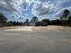 Charming single-story home boasts a spacious front yard and a wide driveway leading to an attached two-car garage at 4162 Sw Gardenia Ct, Dunnellon, FL 34431