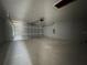 Clean and spacious two-car garage with an automatic door and plenty of room for parking and storage at 4162 Sw Gardenia Ct, Dunnellon, FL 34431