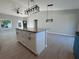 Kitchen featuring a granite island, pendant lighting, ceiling fan, and tile flooring at 4162 Sw Gardenia Ct, Dunnellon, FL 34431