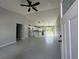 Open floor plan with tile flooring, a ceiling fan, and kitchen island at 4162 Sw Gardenia Ct, Dunnellon, FL 34431