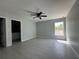 Main bedroom with tile floors, ceiling fan, walk-in closet and ensuite bathroom at 4162 Sw Gardenia Ct, Dunnellon, FL 34431