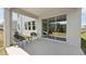 Covered patio featuring outdoor seating and a sliding glass door to the backyard at 4172 Sw 53Rd Lane Rd, Ocala, FL 34474