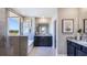 This primary bathroom features a soaking tub, a glass-enclosed shower, and dual vanities with granite countertops at 4180 Sw 53Rd Lane Rd, Ocala, FL 34474