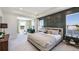 The spacious primary bedroom includes a sitting area and serene views of the water at 4180 Sw 53Rd Lane Rd, Ocala, FL 34474