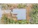 A bird's-eye view of the property, showcasing the house and its surrounding lush greenery at 42 Dogwood Drive Crse, Ocala, FL 34472