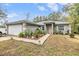 Charming single-story home with attached garage, landscaped front yard and welcoming entrance at 42 Dogwood Drive Crse, Ocala, FL 34472