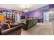 Open-concept living room features soft carpet, a ceiling fan, and dining space at 42 Dogwood Drive Crse, Ocala, FL 34472