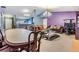 Bright living room and dining area with soft carpet, modern lighting, and stylish furniture at 42 Dogwood Drive Crse, Ocala, FL 34472