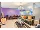Spacious living room and dining area with soft carpet, modern lighting, and comfortable furniture at 42 Dogwood Drive Crse, Ocala, FL 34472