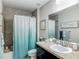 This is a bathroom featuring a toilet, a bathtub, and a sink with a dark cabinet base at 5092 Sw 197Th Ter, Dunnellon, FL 34431