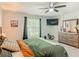 Comfortable bedroom with large window and ceiling fan at 5092 Sw 197Th Ter, Dunnellon, FL 34431